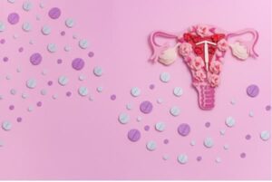 Photo of female reproductive system made up of flowers surrounded by contraception pills. (1)