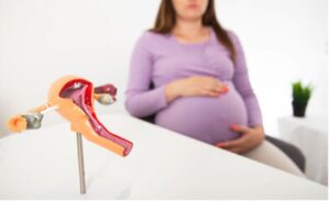 Blurry image of pregnant woman waiting in a doctors office.